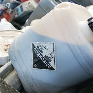 photo of corrosive hazardous waste tub