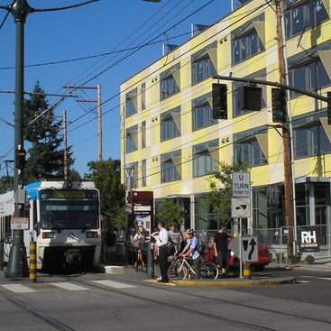 photo of a group of pedestrains getting off of a MAX train