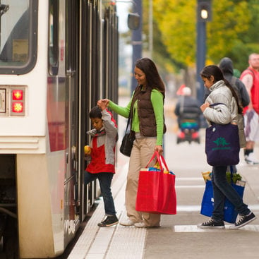 photo of family getting on Max train