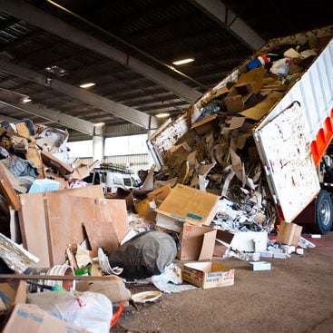 photo of a truck dumping waste at Metro South