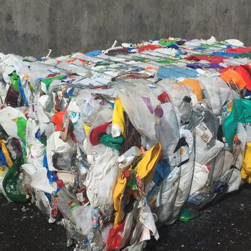 photo of plastic items baled for recycling