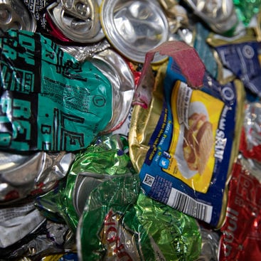 close up of compacted aluminum cans