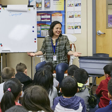 Metro recycling educator presenting to a classroom of young children