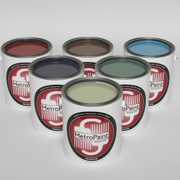6 cans of paint with MetroPaint labels are arranged in a pyramid. The paint can lids are removed to show the colors of paint inside the cans, which are shades of green, brown and blue.
