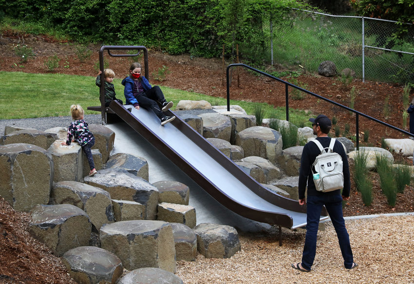 Image of an accessible slide that is placed at the top of gentle slope