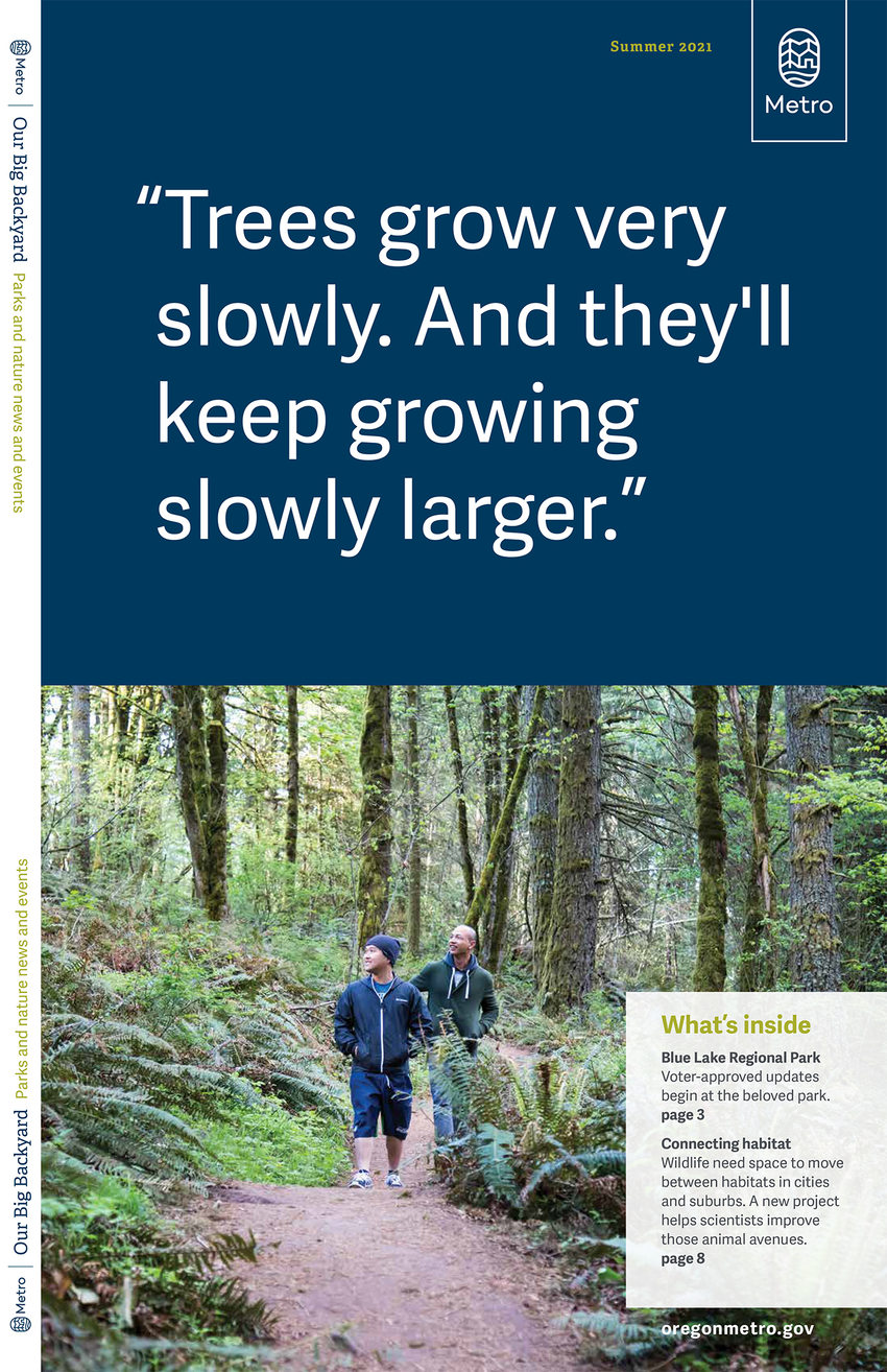 The cover of Our Big Backyard magazine Summer 2021 edition. The top half has the quote "Trees grow very slowly. And they'll keep growing slowly larger." Below the quote is a photograph of two Asian-American men walking along a forest trail.