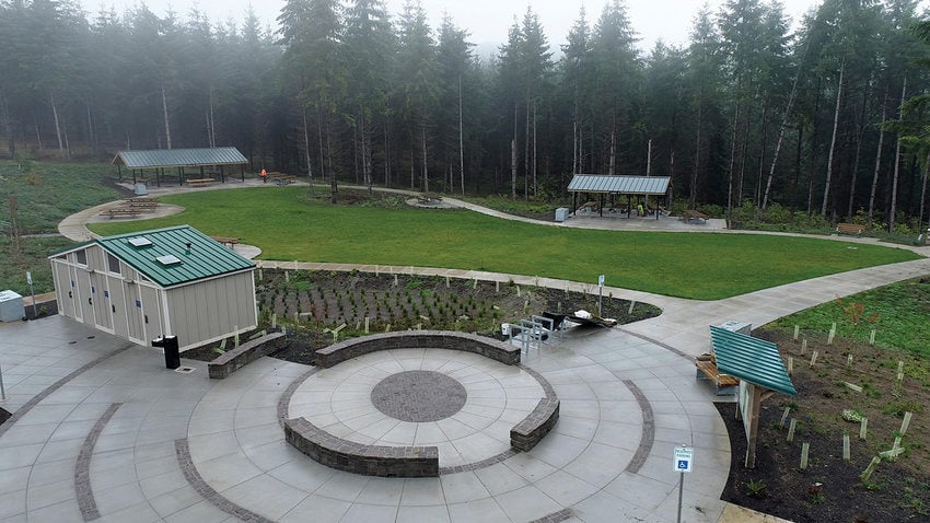 The day-use area at Chehalem Ridge Nature Park with restrooms, an open field and picnic shelters.