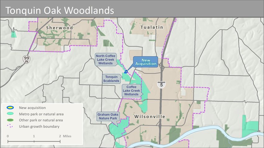 map showing the North Coffee Lake Creek Wetlands and Tonquin Scablands natural areas, with a small piece of property between them outlined and labeled "New Acquisition"