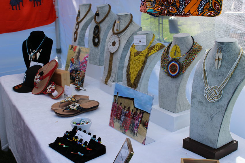 Necklaces, bracelets, rings and other jewelry on display at a vendor booth