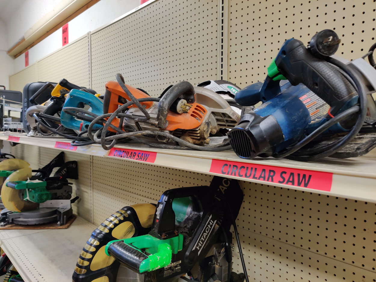 An image of saws on the shelf at a tool library