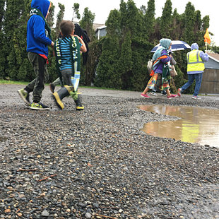 Schoolkids on an unpaved street 