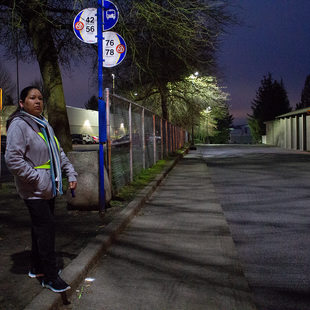 A portrait of Manuela Martinez Espinoza waiting for her bus on an early Saturday morning.