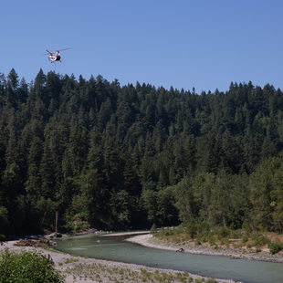 Helicopter delivers large logs alongside the Sandy River at Oxbow Regional Park