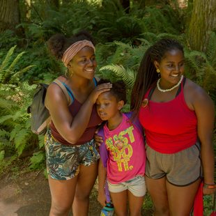 photo of two Camp ELSO guides and one student at Oxbow Regional Park's ancient forest