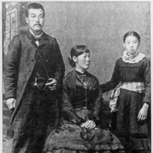 A photo from 1886 of three Japanese Americans wearing formal clothing.