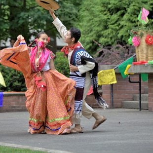 Guelaguetza dancers at a community event