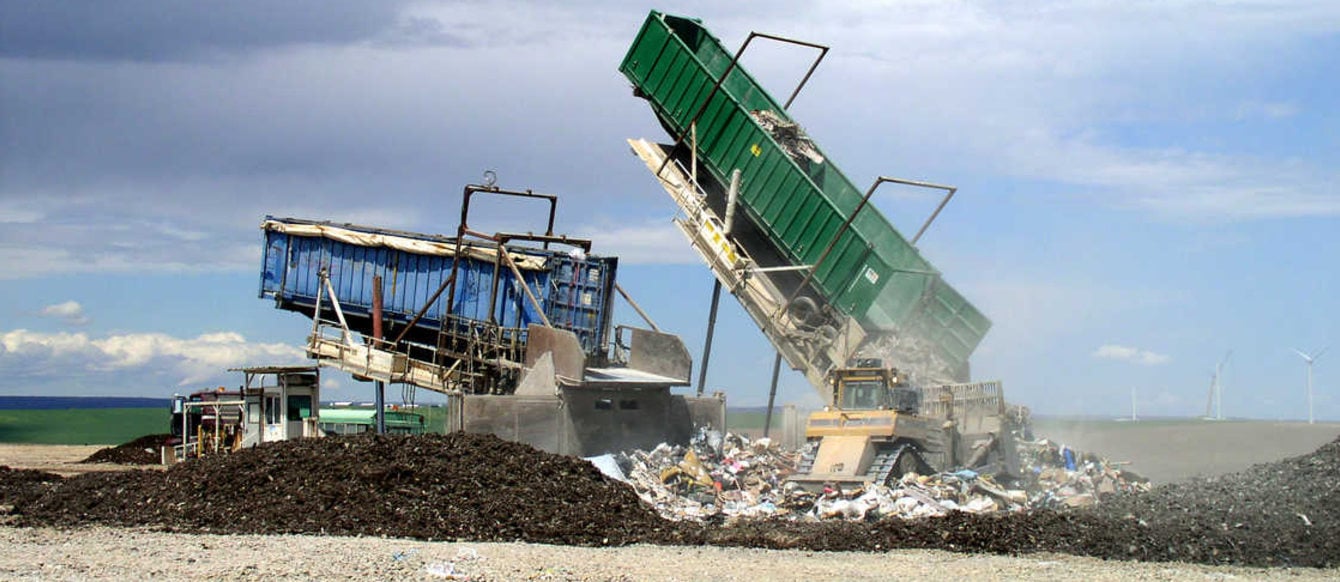 photo of a load of waste being emptied at a landfill