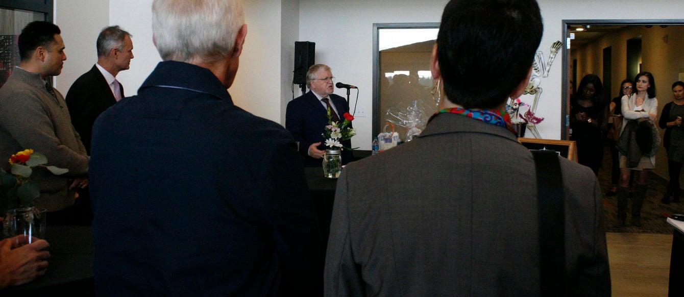 Metro Council president Tom Hughes addresses the crowd gathered for the Hub 9 Grand Opening