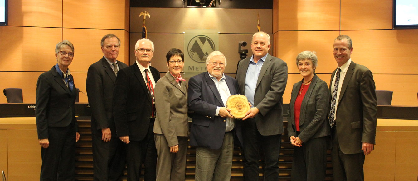 photo of Metro Council receiving Tree for All award from Bruce Roll of Clean Water Services