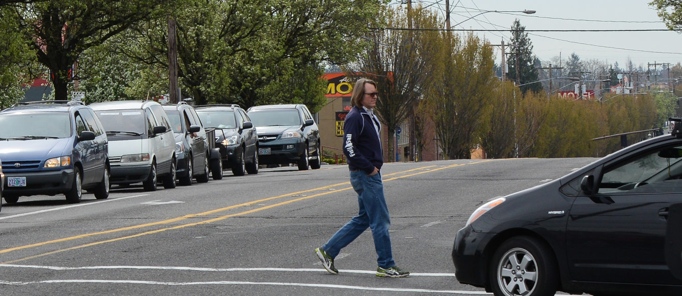 Man crosses 82nd Avenue at Division Street