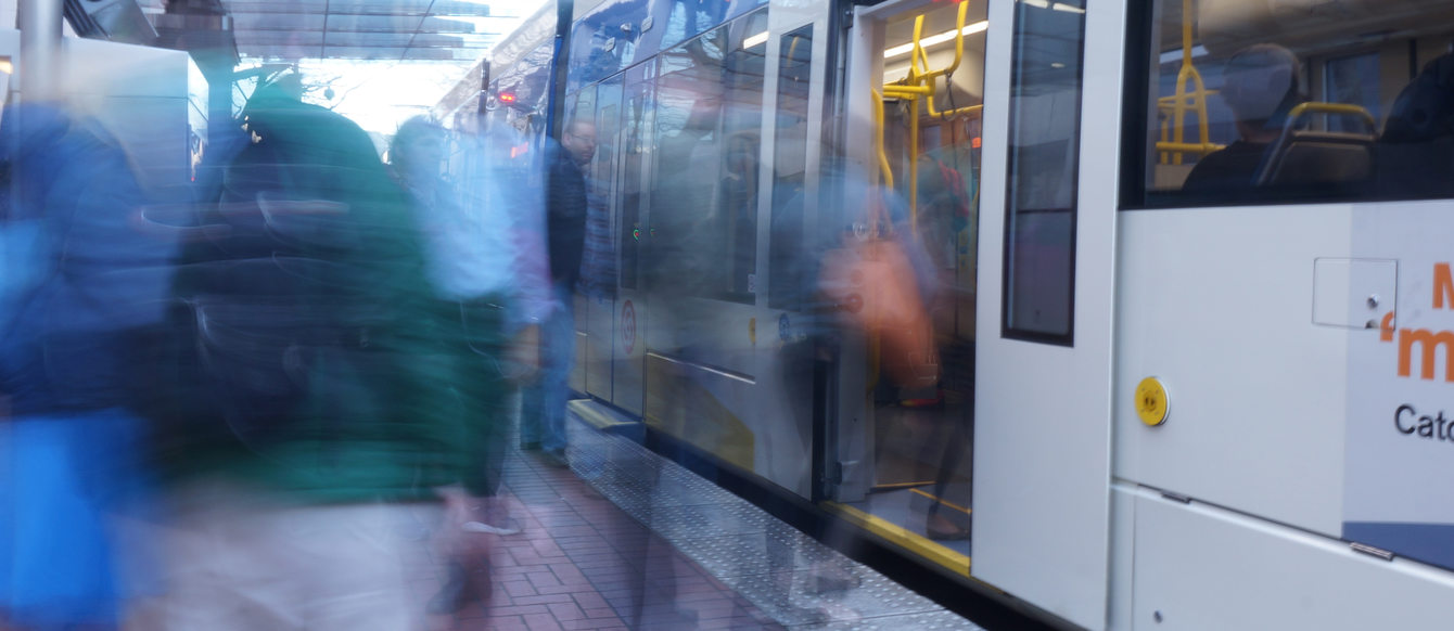 Blurry photo of people getting on light rail