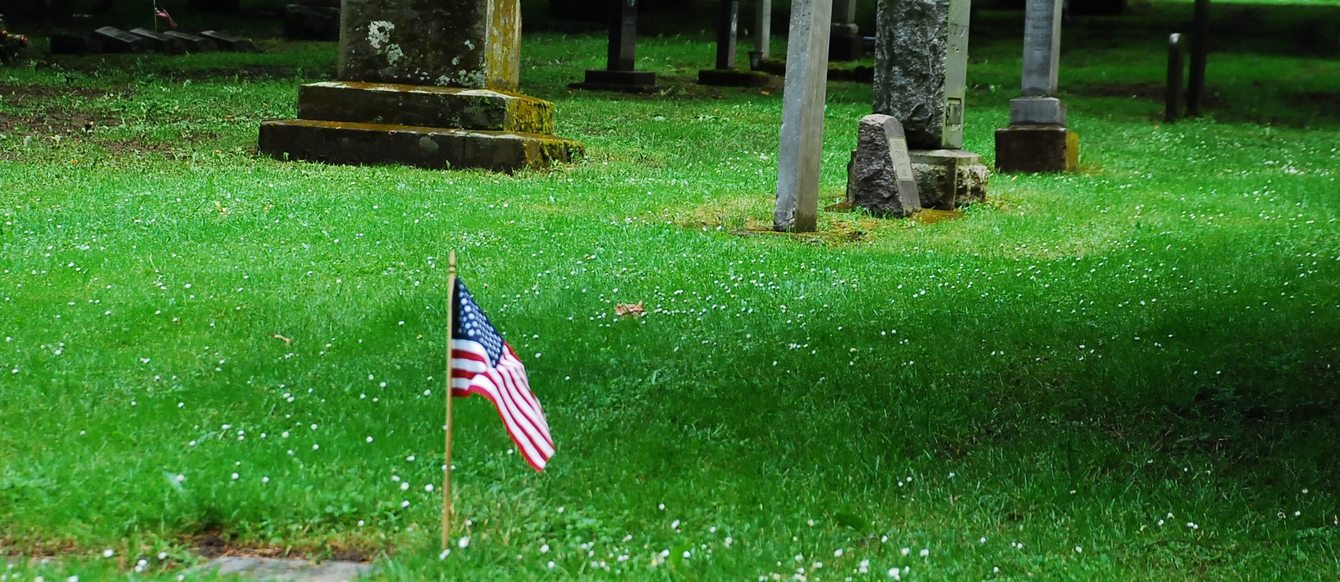 photo of flag at Lone Fir Cemetery during Memorial Day