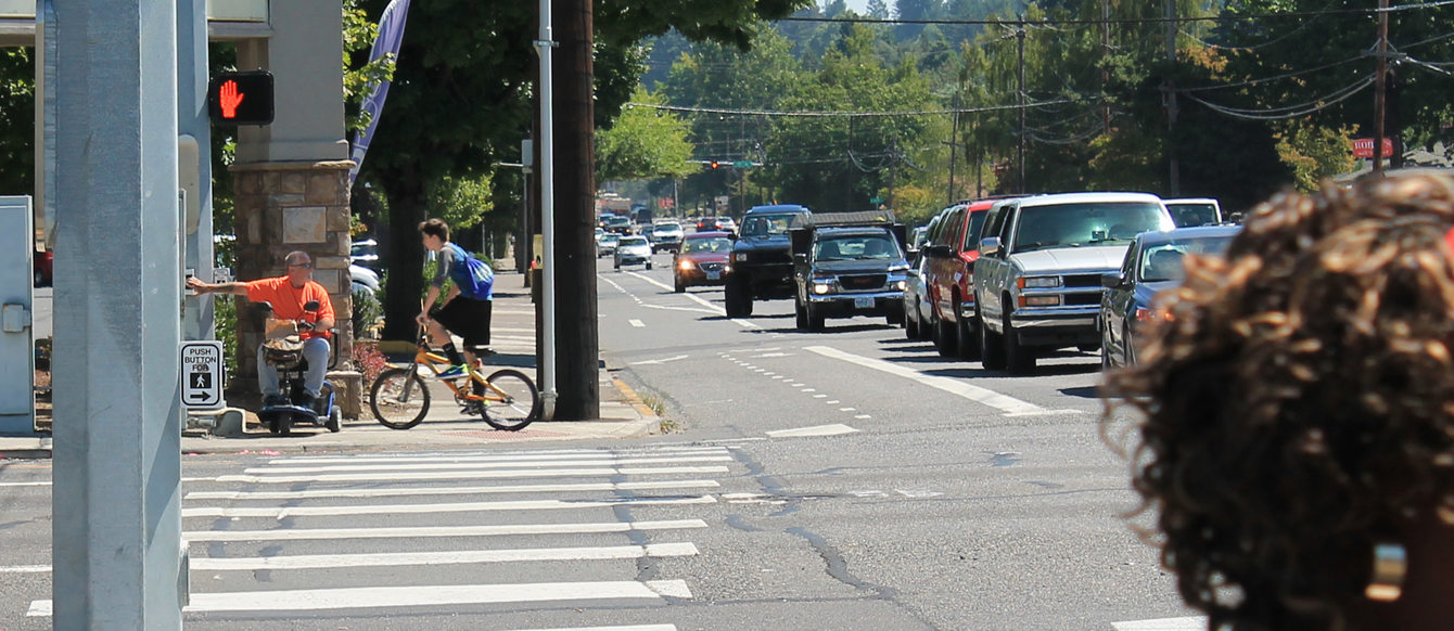 Waiting to cross at 182nd and Division