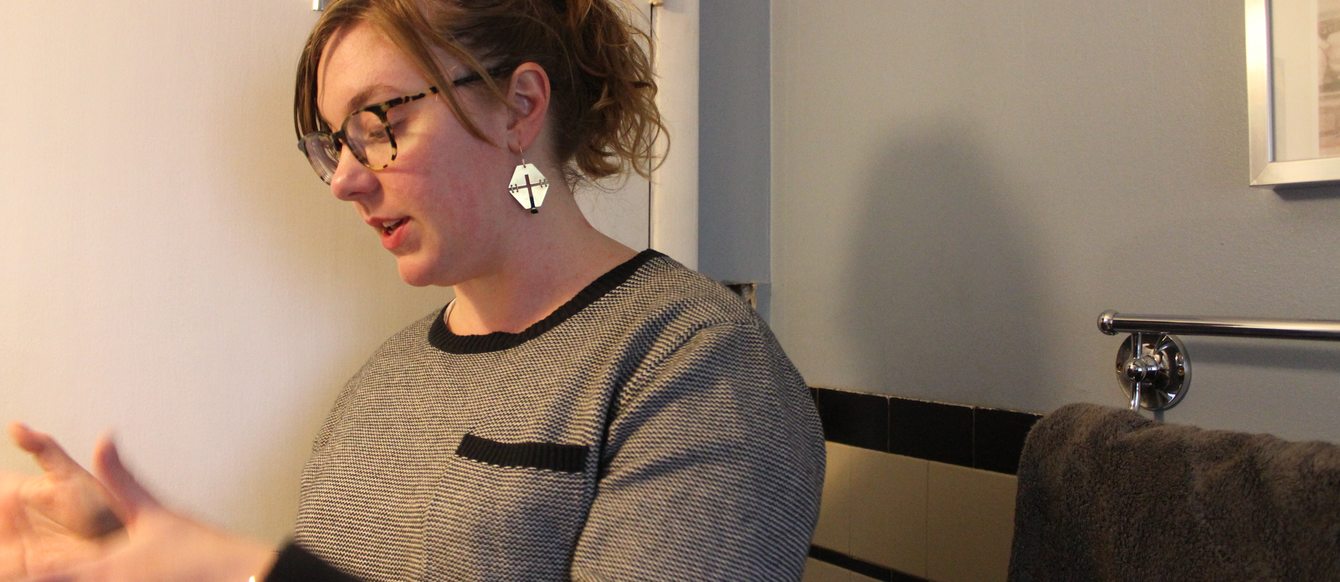 Portland homeowner Andrea Damewood standing in her bathroom.