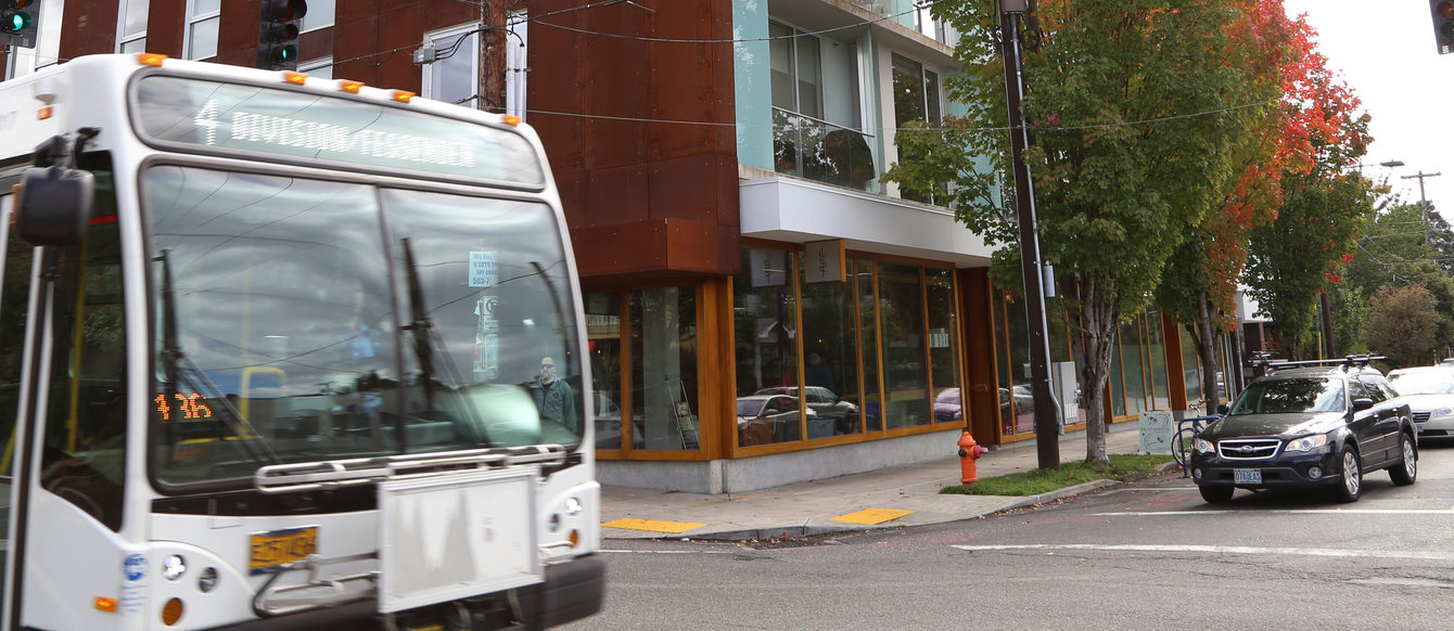 TriMet bus line #4 driving on Southeast Division Street at 26th Avenue