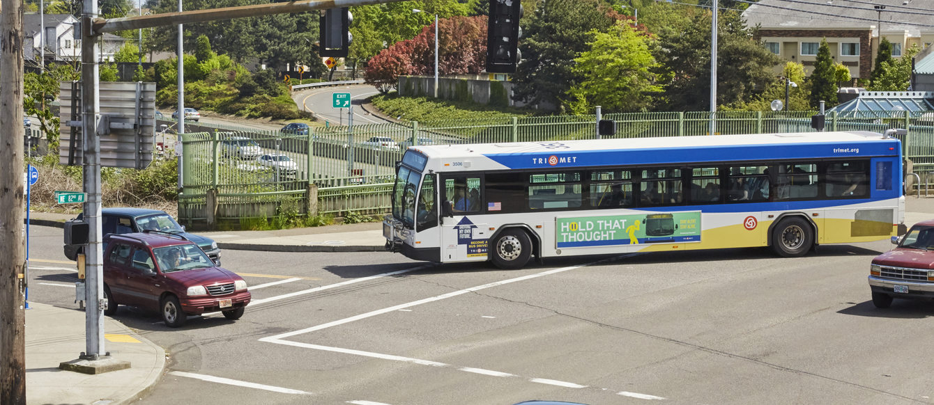 Wide crop of bus and traffic