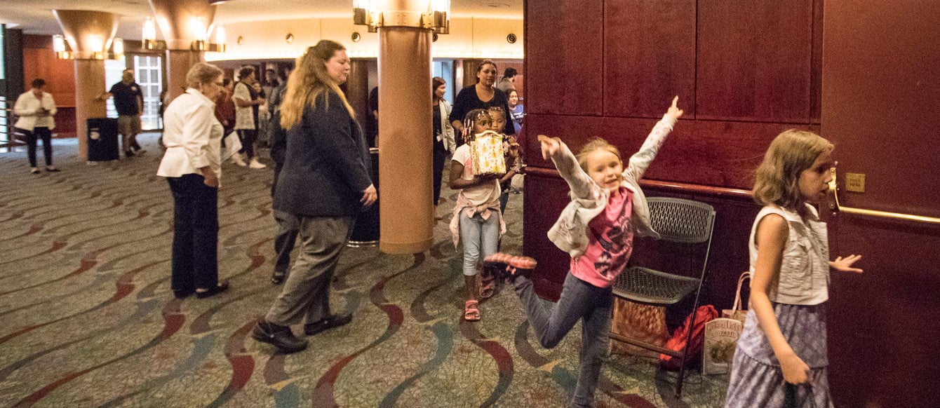 Patrons entering the lobby of a Portland'5 facility to attend a performance of Billy Elliott: The Musical.