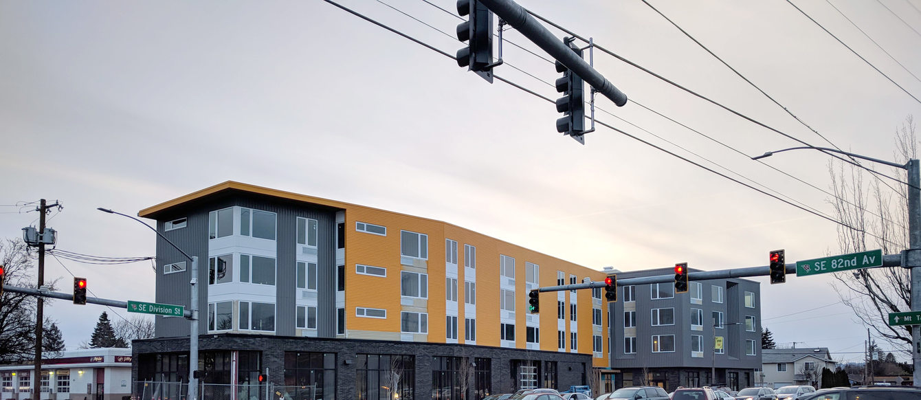 the view of a new apartment building from the corner of SE 82nd Avenue and Division Street