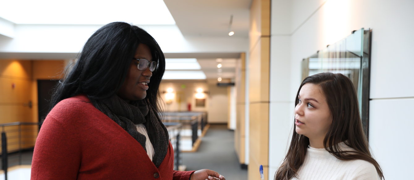 woman interviewing another woman at Metro Regional Center