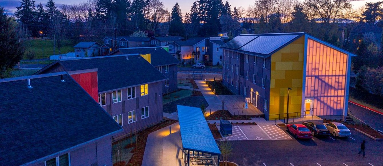 Multi-unit housing complex at dusk