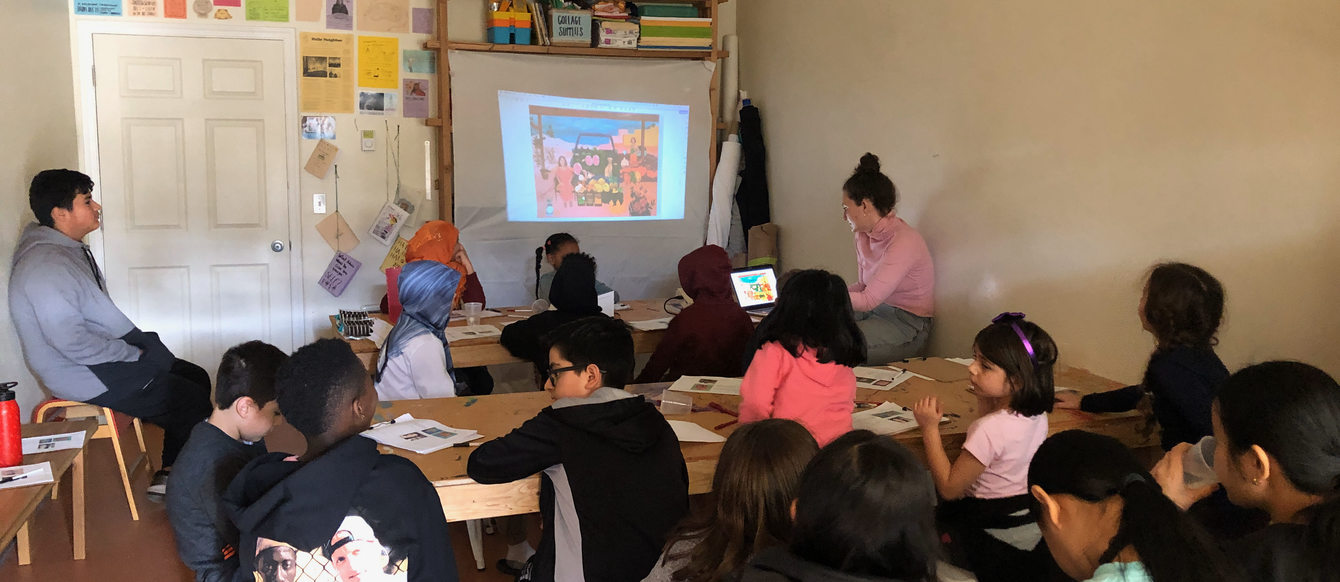 group of young children participate in an art class