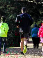 photo of a family running on the fitness trail