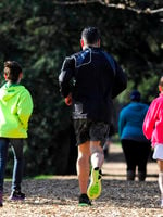 photo of a family running on the fitness trail