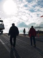 photo of men walking up to a boat at M. James Gleason Boat Ramp