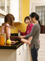 photo of a family using green cleaners in the kitchen