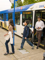 photo of family getting off a bus