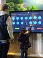 father and son using interactive park finder map at Oregon Zoo Education Center