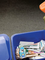 photo of girl recycling orange jug