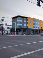 the view of a new apartment building from the corner of SE 82nd Avenue and Division Street