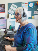 recycling expert on the phone at her desk