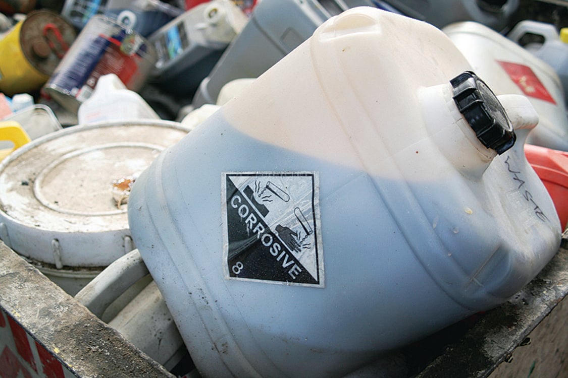 photo of corrosive hazardous waste tub