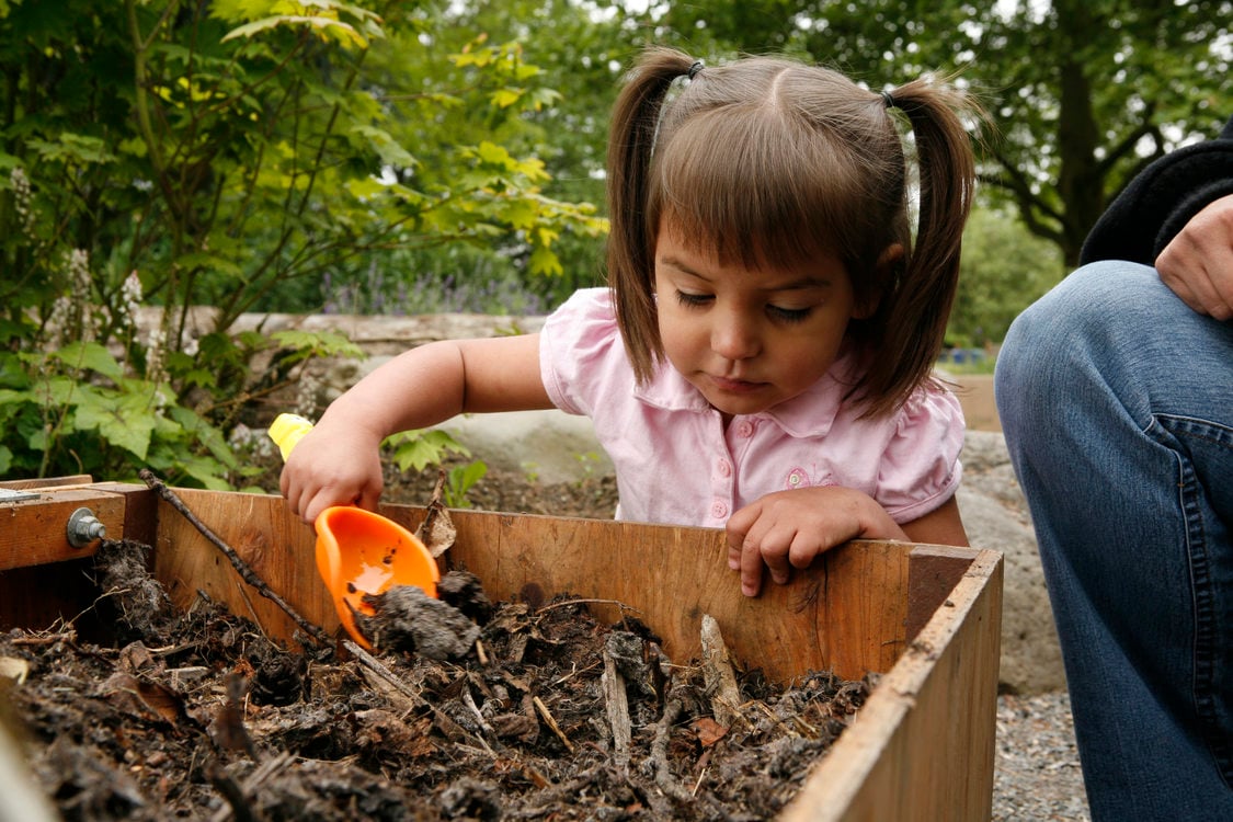 photo of a girl playing in the Blue Lake Natural Discovery Garden