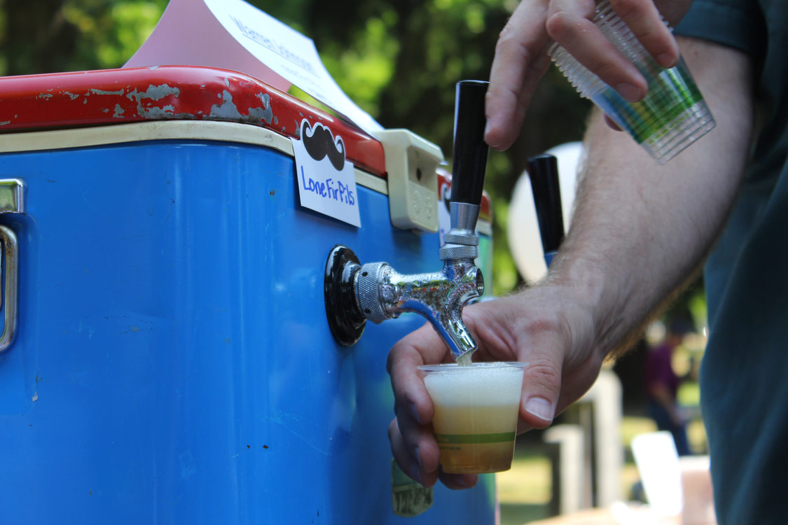 Warren Johnson pours his Lone Fir Pils