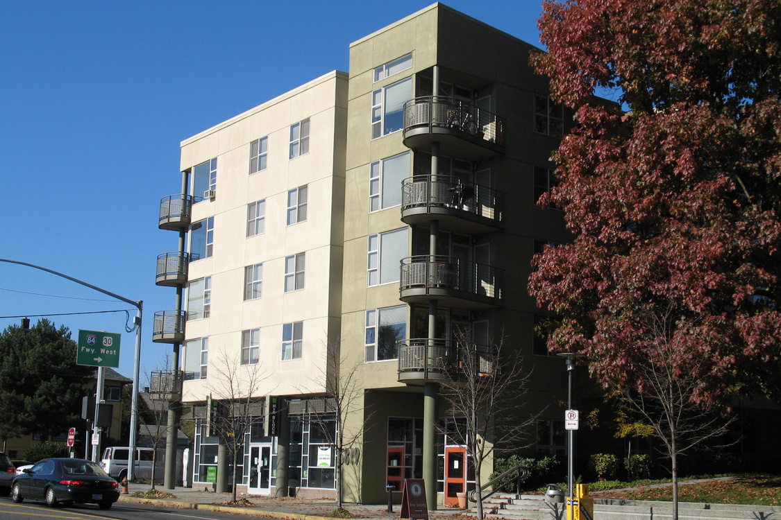 a photo of the exterior of a tall residential building