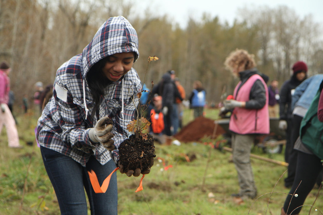 photo of girl at volunteer planting