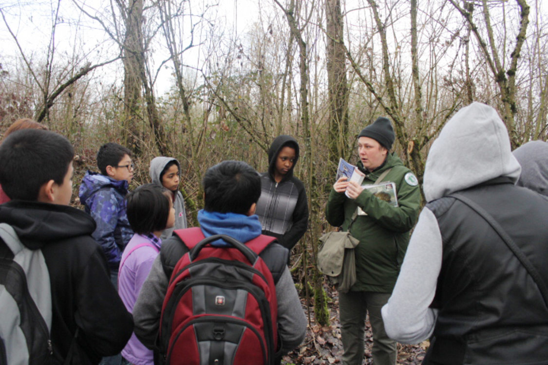 Metro Naturalist Alice Froehlich teaches Marathon Scholars about the great blue herons that live at the Smith and Bybee Natural Area.